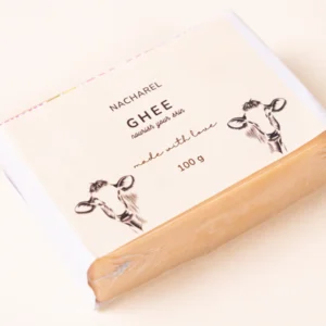 Nacharel Ghee Soap bar showing rich, creamy texture on a wooden soap dish with natural lighting.